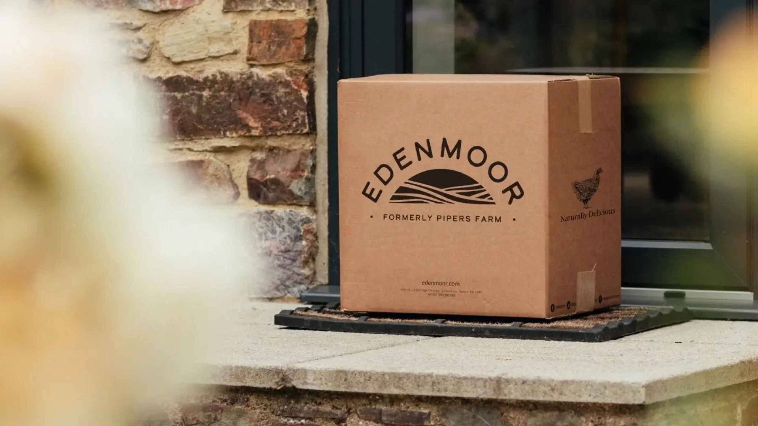 Edenmoor new logo on cardboard box on a stone shelf